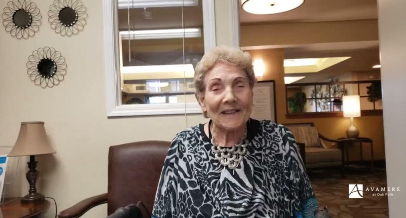 Smiling elderly woman giving a testimonial